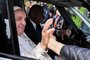 Pope Francis shakes a person's hand from his car as he leaves the Gemelli hospital on April 1, 2023 in Rome, after being discharged following treatment for bronchitis. - The 86-year-old pontiff was admitted to Gemelli hospital on March 29 after suffering from breathing difficulties. (Photo by Tiziana FABI / AFP)<!-- NICAID(15391798) -->