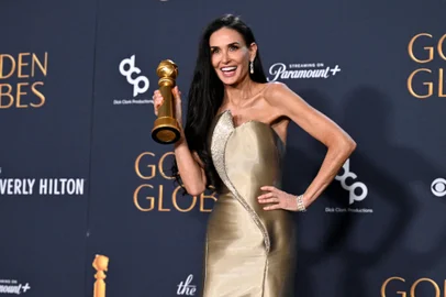 US actress Demi Moore poses with the Best Performance by a Female Actor in a Motion Picture  Musical or Comedy award for "The Substance" in the press room during the 82nd annual Golden Globe Awards at the Beverly Hilton hotel in Beverly Hills, California, on January 5, 2025. (Photo by Robyn Beck / AFP)<!-- NICAID(15947883) -->