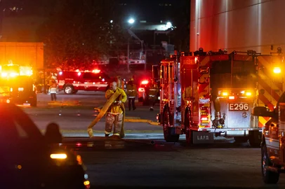 BLAKE FAGAN / AFP First responders work on the scene after a news helicopter crashed in Chatsworth, a suburban neighborhood of Los Angeles, California on September 15, 2026. Three people were killed and one person was hospitalized after the helicopter went down between two commercial buildings, igniting on fire instantly, according to the Los Angeles Fire Department. (Photo by Blake Fagan / AFP)<!-- NICAID(16366682) -->