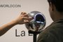 A man has his iris scanned with an orb, a biometric data scanning device, in exchange for the Worldcoin cryptocurrency in Buenos Aires on March 22, 2024. In recent months, hundreds of thousands of Argentines have stood in front of a Worldcoin orb to scan the iris of their eyes in inflation-hit Argentina, where recent tightening delivered the coup de grace. The Worldcoin cryptocurrency, with a verification system based on iris recognition and launched in July 2023 by OpenAI CEO Sam Altman, is being closely watched by regulators in several countries due to data protection concerns. (Photo by JUAN MABROMATA / AFP)Editoria: SCILocal: Buenos AiresIndexador: JUAN MABROMATASecao: identification technologyFonte: AFPFotógrafo: STF<!-- NICAID(15728638) -->