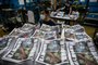 Apple Daily employees work in the printing room as the last edition of the newspaper is printed in Hong Kong early on June 24, 2021. - The 26-year-old tabloid announced closure the previous day after having its assets frozen by the police. (Photo by Anthony WALLACE / AFP)<!-- NICAID(14816957) -->