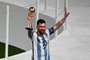 Argentina's forward #10 Lionel Messi poses for pictures with the Golden Ball Award at the end of the Qatar 2022 World Cup final football match between Argentina and France at Lusail Stadium in Lusail, north of Doha on December 18, 2022. (Photo by Jewel SAMAD / AFP)Editoria: SPOLocal: DohaIndexador: JEWEL SAMADSecao: soccerFonte: AFPFotógrafo: STF<!-- NICAID(15298594) -->
