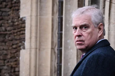 (FILES) Britain's Prince Andrew, Duke of York reacts as he arrives for the Royal Family's traditional Christmas Day service at St Mary Magdalene Church in Sandringham, Norfolk, eastern England, on December 25, 2022. King Charles III will strip his younger brother Andrew of his royal titles and oust him from his long-term residence on the Windsor estate, the palace said on October 30, 2025, the latest fallout to hit the scandal-plagued royal over the Jeffrey Epstein affair. (Photo by Daniel LEAL / AFP)<!-- NICAID(16157725) -->