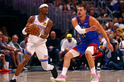 DENVER, CO - MAY 9: Nikola Jokic #15 of the Denver Nuggets plays defense on Shai Gilgeous-Alexander #2 of the Oklahoma City Thunder during Round 2 Game 3 of the 2025 NBA Playoffs on May 9, 2025 at Ball Arena in Denver, Colorado. NOTE TO USER: User expressly acknowledges and agrees that, by downloading and/or using this Photograph, user is consenting to the terms and conditions of the Getty Images License Agreement. Mandatory Copyright Notice: Copyright 2025 NBAE   Zach Beeker/NBAE via Getty Images/AFP (Photo by Zach Beeker / NBAE / Getty Images / Getty Images via AFP)<!-- NICAID(16037483) -->