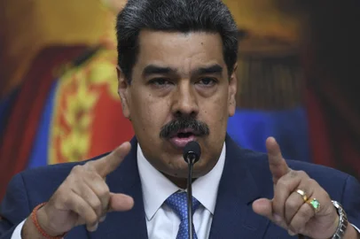 (FILES) Venezuela's President Nicolas Maduro gestures during a press conference with members of the foreign media at Miraflores palace in Caracas, on February 14, 2020. Venezuelan President Nicolas Maduro on October 9, 2023, accused Israel of "genocide" in Palestine after UN Secretary-General Antonio Guterres said he was "distressed" by Israel's announcement of a "total siege" of the Gaza Strip. Israel imposed a total siege on the Gaza Strip and cut off the water supply in response to the October 7 shock deadly attack on Israel by Palestinian militant group Hamas. (Photo by Yuri CORTEZ / AFP)<!-- NICAID(15572209) -->