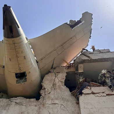 This handout taken and posted on the X (formerly Twitter) account of the Central Industrial Security Force (CISF) On June 12, 2025 shows the back of AN Air India plane after it crashed in a residential area near the airport in Ahmedabad. The London-bound Air India flight 171 passenger plane crashed on June 12 in India's western city of Ahmedabad with 242 on board, aviation officials said in what the airline called a "tragic accident". (Photo by Handout / CENTRAL INDUSTRIAL SECURITY FORCE (CISF) / AFP) / -----EDITORS NOTE --- RESTRICTED TO EDITORIAL USE - MANDATORY CREDIT "AFP PHOTO / CENTRAL INDUSTRIAL SECURITY FORCE (CISF)  " - NO MARKETING - NO ADVERTISING CAMPAIGNS - DISTRIBUTED AS A SERVICE TO CLIENTS<!-- NICAID(16057932) -->