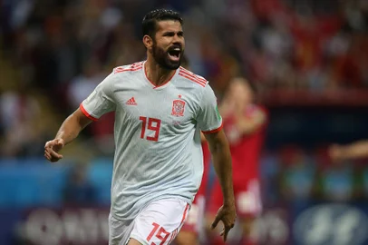 Spain's forward Diego Costa celebrates his goal during the Russia 2018 World Cup Group B football match between Iran and Spain at the Kazan Arena in Kazan on June 20, 2018. (Photo by Roman Kruchinin / AFP) / RESTRICTED TO EDITORIAL USE - NO MOBILE PUSH ALERTS/DOWNLOADSEditoria: SPOLocal: KazanIndexador: ROMAN KRUCHININSecao: soccerFonte: AFPFotógrafo: STR<!-- NICAID(15687465) -->