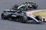 Mercedes' British driver George Russell (front) and Mercedes' British driver Lewis Hamilton (behind) take part in the Formula One Japanese Grand Prix race at the Suzuka circuit in Suzuka, Mie prefecture on April 7, 2024. (Photo by Toshifumi KITAMURA / AFP)<!-- NICAID(15728955) -->