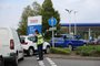 A security guard assists drivers queuing to fill up at a Tesco petrol station in Camberley, west of London on September 26, 2021. - Britain's transport secretary Grant Shapps on Sunday accused lorry industry representatives of helping to spark petrol panic-buying, as he defended a U-turn on post-Brexit immigration policy to ease an escalating supply crisis. (Photo by Adrian DENNIS / AFP)<!-- NICAID(14900964) -->