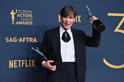 Irish actor Cillian Murphy poses in the press room with the awards for Outstanding Performance by a Male Actor in a Leading Role in a Motion Picture and Outstanding Performance by a Cast in a Motion Picture for "Oppenheimer" during the 30th Annual Screen Actors Guild awards at the Shrine Auditorium in Los Angeles, February 24, 2024. (Photo by Robyn BECK / AFP)<!-- NICAID(15689496) -->