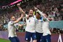 England's forward #20 Phil Foden (R) celebrates with England's midfielder #22 Jude Bellingham (2nd R) and England's midfielder #04 Declan Rice (2nd L) and England's defender #03 Luke Shaw (L) after scoring his team's second goal during the Qatar 2022 World Cup Group B football match between Wales and England at the Ahmad Bin Ali Stadium in Al-Rayyan, west of Doha on November 29, 2022. (Photo by INA FASSBENDER / AFP)Editoria: SPOLocal: DohaIndexador: INA FASSBENDERSecao: soccerFonte: AFPFotógrafo: STR<!-- NICAID(15280440) -->