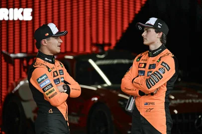 McLaren's British driver Lando Norris (L), who came in second, talks to McLaren's Australian driver Oscar Piastri, who came in third, after the qualifying session of the Formula One Japanese Grand Prix at the Suzuka circuit in Suzuka, Mie prefecture on April 5, 2025. (Photo by MOHD RASFAN / AFP)<!-- NICAID(16019063) -->