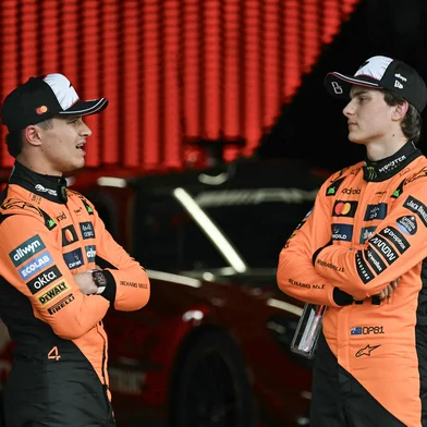 McLaren's British driver Lando Norris (L), who came in second, talks to McLaren's Australian driver Oscar Piastri, who came in third, after the qualifying session of the Formula One Japanese Grand Prix at the Suzuka circuit in Suzuka, Mie prefecture on April 5, 2025. (Photo by MOHD RASFAN / AFP)<!-- NICAID(16019063) -->