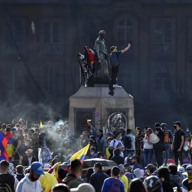 People protest against the government of Colombian President Ivan Duque, at Bolivar square in Bogota on May 12, 2021. - At least 42 people have been killed in near-daily protests against the Colombian government since April 28, the country's human rights ombudsman said Tuesday. The protests, initially against a proposed tax reform, soon morphed into a broader demonstration of anti-government sentiment in a country battling ongoing violence and economic hardship made worse by the coronavirus epidemic. (Photo by JUAN BARRETO / AFP)<!-- NICAID(14782209) -->