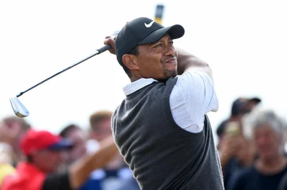 (FILES) In this file photo US golfer Tiger Woods watches his iron shot from the 16th tee during his third round on day 3 of The 147th Open golf Championship at Carnoustie, Scotland on July 21, 2018. - Tiger Woods was hospitalized following a bad single-car accident in Los Angeles County on the morning of February 23, 2021, with officials requiring the jaws of life to free him from the vehicle. "On February 23, 2021, at approximately 7:12 am,  LASD responded to a single vehicle roll-over traffic collision on the border of Rolling Hills Estates and Rancho Palos Verdes," officials say. (Photo by Andy BUCHANAN / AFP)Editoria: SPOLocal: CarnoustieIndexador: ANDY BUCHANANSecao: golfFonte: AFPFotógrafo: STR<!-- NICAID(14720829) -->