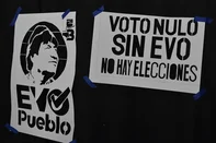 The logo of the "Evo Pueblo" party and a poster that reads "Null Vote. Without Evo, there are no elections" are pictured during the inauguration of a campaign house for the "Null Vote" ahead of the presidential elections in La Paz on August 4, 2025. Supporters of Evo Morales will promote null votes in Bolivia's presidential elections on August 17 as a protest against the former president's exclusion from the polls, his daughter Evaliz Morales told AFP on Monday. (Photo by JORGE BERNAL / AFP)<!-- NICAID(16100851) -->