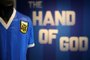 (FILES) In this file photo taken on April 20, 2022 a football shirt worn by Argentina's Diego Maradona during the 1986 World Cup quarter-final match against England, is pictured during a photocall at Sotheby's auction house in London ahead of its sale. - The jersey that Argentina football legend Diego Maradona wore when scoring twice against England in the 1986 World Cup, including the infamous "hand of God" goal, was auctioned for $9.3 million, a record for any item of sports memorabilia, Sotheby's said May 4, 2022. (Photo by ADRIAN DENNIS / AFP)<!-- NICAID(15086496) -->