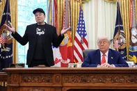 WASHINGTON, DC - MAY 30: Tesla CEO Elon Musk speaks alongside U.S. President Donald Trump to reporters in the Oval Office of the White House on May 30, 2025 in Washington, DC. Musk, who served as an adviser to Trump and led the Department of Government Efficiency, announced he would leave his role in the Trump administration to refocus on his businesses.   Kevin Dietsch/Getty Images/AFP (Photo by Kevin Dietsch / GETTY IMAGES NORTH AMERICA / Getty Images via AFP)<!-- NICAID(16049363) -->