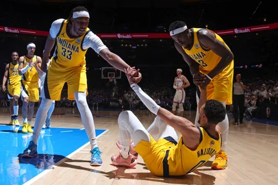 OKLAHOMA CITY, OK - JUNE 16: Myles Turner #33 and Pascal Siakam #43 of the Indiana Pacers help up Tyrese Haliburton #0 during the game against the Oklahoma City Thunder during Game Five of the 2025 NBA Finals on June 16, 2025 at Paycom Center in Oklahoma City, Oklahoma. NOTE TO USER: User expressly acknowledges and agrees that, by downloading and or using this photograph, User is consenting to the terms and conditions of the Getty Images License Agreement. Mandatory Copyright Notice: Copyright 2025 NBAE  Nathaniel S. Butler/NBAE via Getty Images/AFP (Photo by Nathaniel S. Butler / NBAE / Getty Images / Getty Images via AFP)<!-- NICAID(16063116) -->