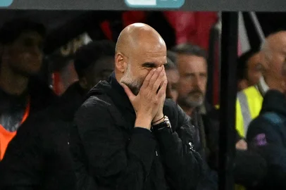 Manchester City's Spanish manager Pep Guardiola reacts during the English Premier League football match between Bournemouth and Manchester City at the Vitality Stadium in Bournemouth, southern England on May 19, 2026. (Photo by Glyn KIRK / AFP) / RESTRICTED TO EDITORIAL USE. No use with unauthorized audio, video, data, fixture lists, club/league logos or 'live' services. Online in-match use limited to 120 images. An additional 40 images may be used in extra time. No video emulation. Social media in-match use limited to 120 images. An additional 40 images may be used in extra time. No use in betting publications, games or single club/league/player publications. / <!-- NICAID(16288613) -->