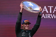 Mercedes' British driver George Russell celebrates on the podium after winning the Formula One Australian Grand Prix at the Albert Park Circuit in Melbourne on March 8, 2026. (Photo by WILLIAM WEST / AFP) / -- IMAGE RESTRICTED TO EDITORIAL USE - STRICTLY NO COMMERCIAL USE --<!-- NICAID(16240414) -->