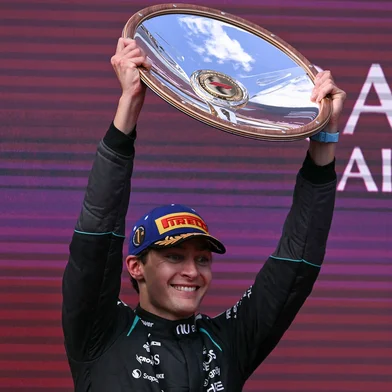 Mercedes' British driver George Russell celebrates on the podium after winning the Formula One Australian Grand Prix at the Albert Park Circuit in Melbourne on March 8, 2026. (Photo by WILLIAM WEST / AFP) / -- IMAGE RESTRICTED TO EDITORIAL USE - STRICTLY NO COMMERCIAL USE --<!-- NICAID(16240414) -->