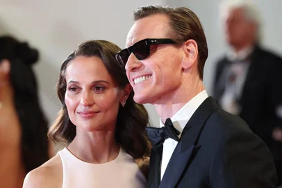 Swedish actress Alicia Vikander and German actor Michael Fassbender arrive for the screening of the film "Hope" at the 79th edition of the Cannes Film Festival in Cannes, southern France on May 17, 2026. (Photo by Valery HACHE / AFP)<!-- NICAID(16381370) -->