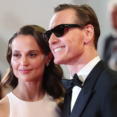 Swedish actress Alicia Vikander and German actor Michael Fassbender arrive for the screening of the film "Hope" at the 79th edition of the Cannes Film Festival in Cannes, southern France on May 17, 2026. (Photo by Valery HACHE / AFP)<!-- NICAID(16381370) -->