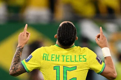 Brazil's defender #16 Alex Telles celebrates after Brazil won the Qatar 2022 World Cup Group G football match between Brazil and Switzerland at Stadium 974 in Doha on November 28, 2022. (Photo by Fabrice COFFRINI / AFP)<!-- NICAID(15279062) -->