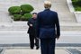 (FILES) In this file photo taken on June 30, 2019 North Korea's leader Kim Jong Un walks to greet US President Donald Trump at the Military Demarcation Line that divides North and South Korea, in the Joint Security Area (JSA) of Panmunjom in the Demilitarized zone (DMZ). - The United States on December 9, 2019 called a UN Security Council meeting this week on the risk of North Korean "provocation" as Pyongyang demands US concessions by a year-end deadline. The United States, which holds this month's presidency of the Security Council, is scheduling the session instead of a planned meeting on human rights in North Korea, one of the world's most authoritarian states. (Photo by Brendan Smialowski / AFP)