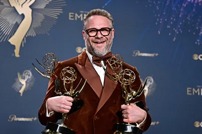 Canadian-US actor Seth Rogen poses in the press room with the  awards for Outstanding Writing for a Comedy Series, Outstanding Directing for a Comedy Series, Outstanding Lead Actor in a Comedy Series and Outstanding Comedy Series for "The Studio" during the 77th Primetime Emmy Awards at the Peacock Theatre at LA Live in Los Angeles on September 14, 2025. (Photo by Frederic J. Brown / AFP) / RESTRICTED TO EDITORIAL USE<!-- NICAID(16124199) -->