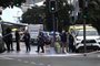 Police officers stand at the site of a shooting in central Auckland on July 20, 2023. A gunman opened fire at a building site in central Auckland on July 20, 2023 in an "alarming incident" that left two people and the shooter dead, New Zealand police said. (Photo by Saeed KHAN / AFP)Editoria: CLJLocal: AucklandIndexador: SAEED KHANSecao: crimeFonte: AFPFotógrafo: STF<!-- NICAID(15487226) -->