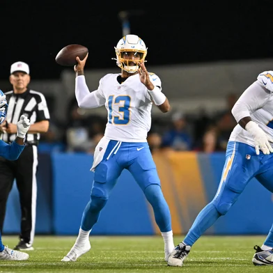 CANTON, OHIO - JULY 31: DJ Uiagalelei #13 of the Los Angeles Chargers throws a pass during the fourth quarter of the 2025 Pro Football Hall of Fame Game against the Detroit Lions at Tom Benson Hall of Fame Stadium on July 31, 2025 in Canton, Ohio.   Nick Cammett/Getty Images/AFP (Photo by Nick Cammett / GETTY IMAGES NORTH AMERICA / Getty Images via AFP)<!-- NICAID(16095503) -->