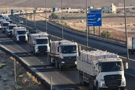 A handout picture provided by the Jordanian Public Security Directorate on July 27, 205, shows a convoy of trucks loaded with humanitarian aid and destined to the Gaza Strip, driving on a road in Jordan toward the Israeli military post in the Zikim area. (Photo by Jordanian Public Security Directorate / AFP) / === RESTRICTED TO EDITORIAL USE - MANDATORY CREDIT "AFP PHOTO / HO / JORDANIAN PUBLIC SECURITY DIRECTORATE" - NO MARKETING NO ADVERTISING CAMPAIGNS - DISTRIBUTED AS A SERVICE TO CLIENTS ===<!-- NICAID(16088577) -->