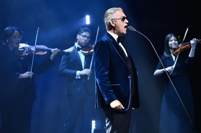 Italian opera singer Andrea Bocelli performs on stage during the draw for the 2026 FIFA Football World Cup taking place in the US, Canada and Mexico, at the Kennedy Center, in Washington, DC, on December 5, 2025. (Photo by SAUL LOEB / AFP)<!-- NICAID(16181244) -->