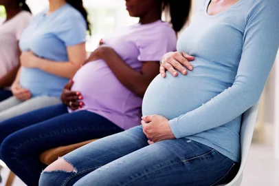 Pregnant Woman Group In Row. Young MothersFonte: 611674252<!-- NICAID(16038657) -->