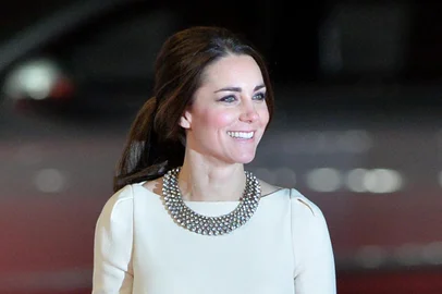 Britains Catherine, Duchess of Cambridge, arrives with Prince William, Duke of Cambridge (not pictured), to attend the royal film premier of Mandela: Long Walk to Freedom in central London on December 5, 2013. The film is adapted from former South African President Nelson Mandelas auto-biography and chronicles the life journey from his childhood in a rural village through his struggle for rights during the apartheid era and his inauguration as the first democratically elected president of South Africa. AFP PHOTO/BEN STANSALL<!-- NICAID(10031091) -->