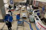 A man stands in front of a cordoned-off area, where Covid-19 coronavirus patients lie on hospital beds, in the lobby of the Chongqing No. 5 People's Hospital in China's southwestern city of Chongqing on December 23, 2022. (Photo by Noel CELIS / AFP)Editoria: HTHLocal: ChongqingIndexador: NOEL CELISSecao: diseaseFonte: AFPFotógrafo: STF<!-- NICAID(15303627) -->