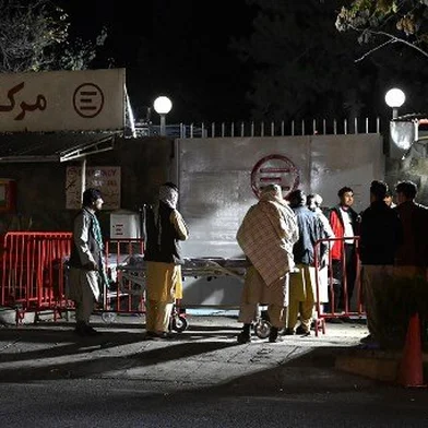 Relatives of blast victims gather outside the Italian aid organisation 'Emergency' hospital in Kabul on November 7, 2023, following an explosion on a bus. Seven people died and 20 others were injured in a bus explosion in the Afghan capital on November 7, police said.
