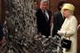 Britain's Queen Elizabeth II views props during her visit to the set of the HBO TV series "Game of Thrones"  in the Titanic Quarter in Belfast on June 24, 2014.  AFP PHOTO/POOL/Jonathan Porter