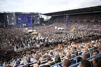 The Villa Park crowd watch support acts, during British rock band Black Sabbath's "Back to The Beginning" concert, Ozzy Osbourne's final ever gig as Black Sabbath's frontman at Villa Park in Birmingham, central England on July 5, 2025. Osbourne, who revealed in 2020 that he has Parkinson's disease, will join Tony Iommi, Geezer Butler and Bill Ward for the all-day "Back To The Beginning" show in Birmingham, central England, where the heavy metal giants formed in 1968. (Photo by ANDY BUCHANAN / AFP)<!-- NICAID(16074157) -->
