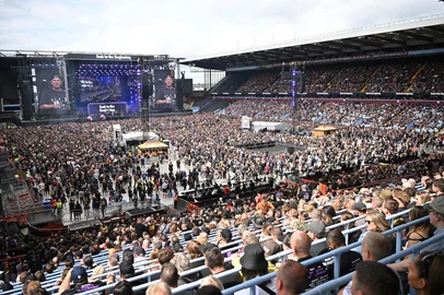 The Villa Park crowd watch support acts, during British rock band Black Sabbath's "Back to The Beginning" concert, Ozzy Osbourne's final ever gig as Black Sabbath's frontman at Villa Park in Birmingham, central England on July 5, 2025. Osbourne, who revealed in 2020 that he has Parkinson's disease, will join Tony Iommi, Geezer Butler and Bill Ward for the all-day "Back To The Beginning" show in Birmingham, central England, where the heavy metal giants formed in 1968. (Photo by ANDY BUCHANAN / AFP)<!-- NICAID(16074157) -->