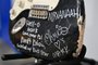 (FILES) Kurt Cobain's smashed Fender Stratocaster is pictured on dispaly at Julien's Auctions in Gardena, California on May 2, 2023, ahead of Julien's "Music Icons" auction of over 1,200 items from Rock And Roll history and exclusive artist collections. A guitar smashed on stage by Nirvana front man Kurt Cobain sold for nearly $600,000, several times its original estimate, an auction house said May 20, 2023. The busted black Fender Stratocaster has been put back together, but is no longer playable, Kody Frederick of Julien's Auctions told AFP earlier this month. It was signed by all three members of the Seattle grunge outfit as they rocketed to global fame. (Photo by Frederic J. BROWN / AFP)<!-- NICAID(15434675) -->