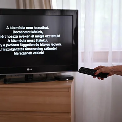 A message can be read on a tv screen at a family home in Agard, Hungary on July 7, 2026, as the main state channel, the M1 informs viewers of the temporary suspension of news broadcasts in all state broadcasters. Message reads - 'The public state media cannot lie. We apologize for doing this for so many years! The public media is now transforming itself to be independent and credible in the future. News service is temporarily suspended! Stay tuned!). Two Hungarian public broadcasters close to Viktor Orban have halted broadcasting as part of efforts to undo the longtime nationalist leader's hold on the media, Prime Minister Peter Magyar said on July 7, 2026."A historic day. Today marks the end of propaganda broadcasts on public media platforms," Magyar, who ousted Orban as prime minister in April, said on Facebook. (Photo by Attila KISBENEDEK / AFP)<!-- NICAID(16325188) -->