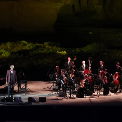 A handout picture released by the Royal Commission for Al-Ula shows Italian tenor and opera singer Andrea Bocelli singing during a concert at the Hegra World Heritage Site in the northwestern Saudi city of al-Ula on April 8, 2021. (Photo by Neville Hopwood / THE ROYAL COMISSION FOR AL-ULA / AFP) / RESTRICTED TO EDITORIAL USE - MANDATORY CREDIT "AFP PHOTO / THE ROYAL COMISSION FOR AL-ULA / NEVILLE HOPWOOD " - NO MARKETING - NO ADVERTISING CAMPAIGNS - DISTRIBUTED AS A SERVICE TO CLIENTS<!-- NICAID(14754060) -->