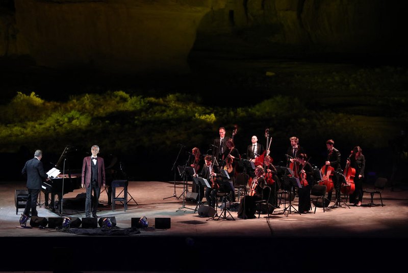 A handout picture released by the Royal Commission for Al-Ula shows Italian tenor and opera singer Andrea Bocelli singing during a concert at the Hegra World Heritage Site in the northwestern Saudi city of al-Ula on April 8, 2021. (Photo by Neville Hopwood / THE ROYAL COMISSION FOR AL-ULA / AFP) / RESTRICTED TO EDITORIAL USE - MANDATORY CREDIT "AFP PHOTO / THE ROYAL COMISSION FOR AL-ULA / NEVILLE HOPWOOD " - NO MARKETING - NO ADVERTISING CAMPAIGNS - DISTRIBUTED AS A SERVICE TO CLIENTS<!-- NICAID(14754060) -->