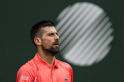 Serbia's Novak Djokovic reacts during his match against Hungary's Marton Fucsovics at the ATP 250 Geneva Open tennis tournament in Geneva on May 21, 2025. (Photo by FABRICE COFFRINI / AFP)<!-- NICAID(16044398) -->