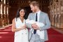 Britain's Prince Harry, Duke of Sussex (R), and his wife Meghan, Duchess of Sussex, pose for a photo with their newborn baby son in St George's Hall at Windsor Castle in Windsor, west of London on May 8, 2019. (Photo by Dominic Lipinski / POOL / AFP)<!-- NICAID(14069346) -->