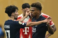 Paris Saint-Germain's French midfielder #14 Desire Doue (R) celebrates with teammate Portuguese midfielder #17 Vitinha (L) after scoring his team's first goal  during the FIFA Club World Cup 2025 quarterfinal football match between France's Paris Saint-Germain and Germany's Bayern Munich at the Mercedes-Benz Stadium in Atlanta on July 5, 2025. (Photo by Paul ELLIS / AFP)<!-- NICAID(16074081) -->