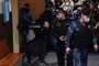 A man suspected of taking part in the attack of a concert hall that killed 137 people, the deadliest attack in Europe to have been claimed by the Islamic State jihadist group, is escorted by Russian law enforcement officers prior to his pre-trial detention hearing at the Basmanny District Court in Moscow on March 24, 2024. At least 137 people, including three children, were killed when camouflaged gunmen stormed the Crocus City Hall, in Moscow's northern suburb of Krasnogorsk, and then set fire to the building on March 22 evening. (Photo by Olga MALTSEVA / AFP)<!-- NICAID(15714959) -->